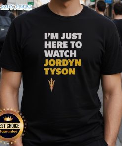 Alt Text: Top Jordyn Tyson I'M Just Here To Watch T-Shirt featuring bold graphics and casual style for fans and everyday wear.