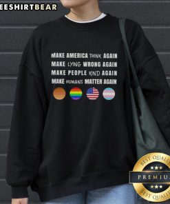 Alt Text: Men and women wearing 'Make America Think Again' sweatshirt promoting values of honesty and humanity.