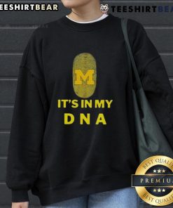 Cozy Top Michigan It's In My DNA sweatshirt displayed on a wooden table, perfect for proud Michiganders.