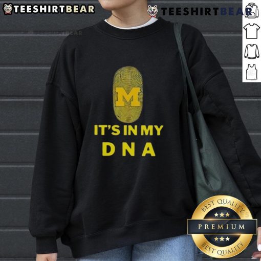 Cozy Top Michigan It's In My DNA sweatshirt displayed on a wooden table, perfect for proud Michiganders.
