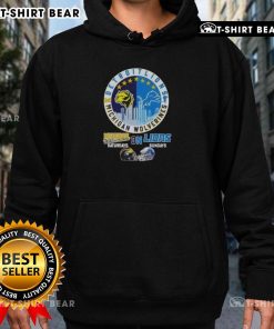 Men's hoodie featuring Michigan Wolverines and Detroit Lions helmets with skyline design for game day style.