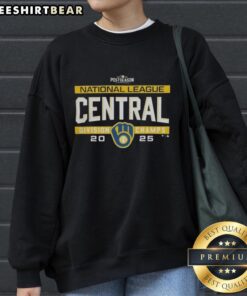 Alt Text: Milwaukee Brewers 2025 NL Central Division title sweatshirt in team locker room, celebrating postseason success.
