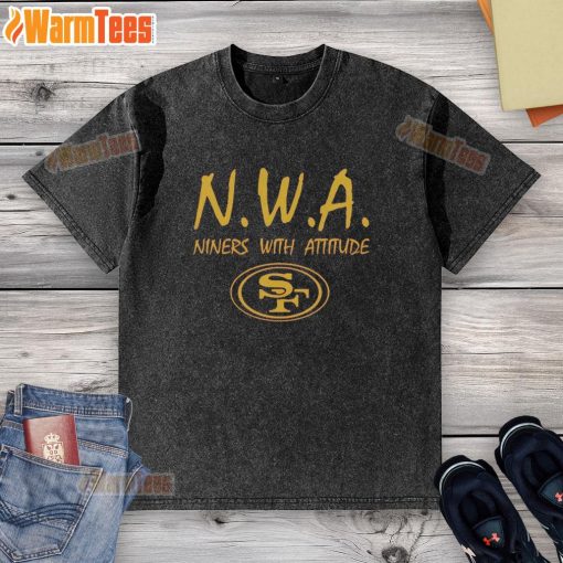 Top NWA Nines With Attitude San Francisco 49ers logo washed t-shirt displayed on a wooden background.