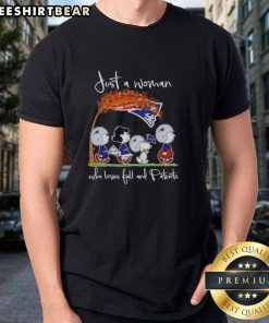 Alt Text: Woman wearing a 'Top Peanuts Just A Woman Who Loves Fall And New England Patriots' t-shirt in a fall setting.