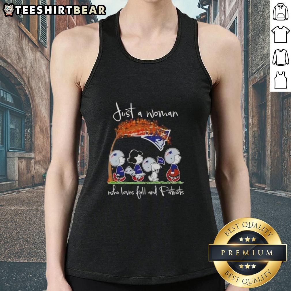 Top Peanuts Just A Woman Who Loves Fall And New England Patriots Tank Top Woman in a fall setting wearing a New England Patriots tank top, showcasing her love for autumn and football.