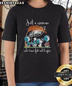 Top Peanuts Just A Woman Who Loves Fall and Philadelphia Eagles Football Ladies Tee in vibrant colors, perfect for fans.