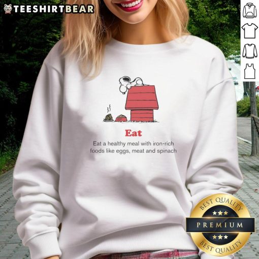 Top Peanuts x American Red Cross sweatshirt promoting healthy meals with iron-rich foods like eggs, meat, and spinach.