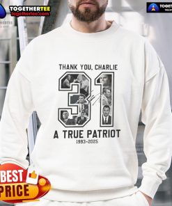 Alt Text: Top RIP Charlie Kirk A True Patriot 1993-2025 Thank You Signature Memorial Sweatshirt displayed on a wooden background.