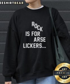 Trendy 'Top Rock is for Arse Lickers' sweatshirt displayed on a model, showcasing bold graphics and casual style.