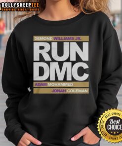 Alt Text: Top Run DMC Football sweatshirt featuring Demond Williams Jr., Adam Mohammed, and Johnah Coleman in action.