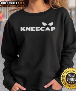 Top Sami Zayn wearing a stylish kneecap sweatshirt, showcasing his unique fashion sense at a wrestling event.