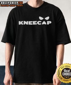 Alt Text: Top Sami Zayn wearing a stylish Kneecap T-Shirt, showcasing his unique wrestling style and personality.