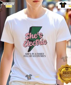 Top She's Electric She's In A Family Full Of Eccentrics T-Shirt featuring vibrant design and quirky text for unique style.