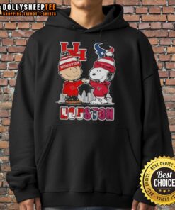Alt Text: Cozy hoodie featuring Snoopy and Charlie Brown with Houston skyline, perfect for Cougars and Texans fans.