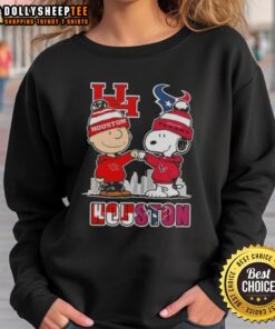 Cozy Houston sports sweatshirt featuring Snoopy and Charlie Brown with a skyline design for Cougars and Texans fans.