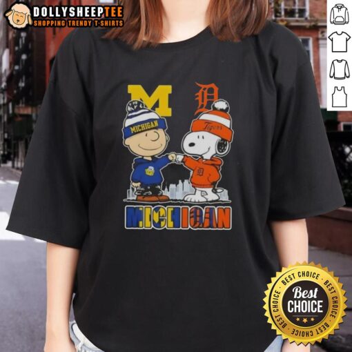 Top Snoopy and Charlie Brown Michigan Sports tee featuring Wolverines and Detroit Tigers skyline design for ladies.