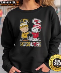 Snoopy and Charlie Brown on a Missouri Tigers x Kansas City Chiefs skyline sweatshirt, perfect for sports fans.