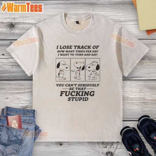 Alt Text: Snoopy graphic on a washed t-shirt, expressing the humorous struggle of daily distractions and thoughts.