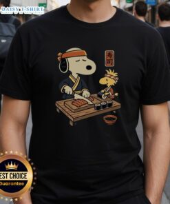 Alt Text: Top Snoopy Woodstock Sushi Tomodachi Club T-Shirt featuring colorful cartoon graphics of Snoopy and Woodstock enjoying sushi.