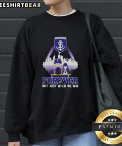 Alt Text: Cozy skyline sweatshirt featuring Snoopy and Charlie Brown, celebrating Fremantle Dockers fandom, Forever, Not Just When We Win.