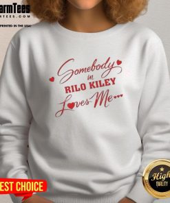 Alt Text: Trendy 'Somebody In Rilo Kiley Loves Me' sweatshirt featuring a stylish design, perfect for fans of the band.