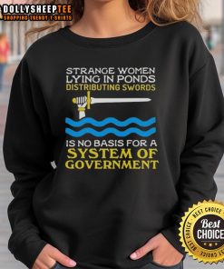 Top Strange Women Lying in Ponds Distributing Swords Sweatshirt design featuring whimsical art and humorous text.