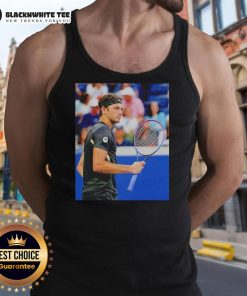 Taylor Fritz wearing a stylish tank top at the US Open 2025, showcasing his athleticism and sportsmanship on the court.