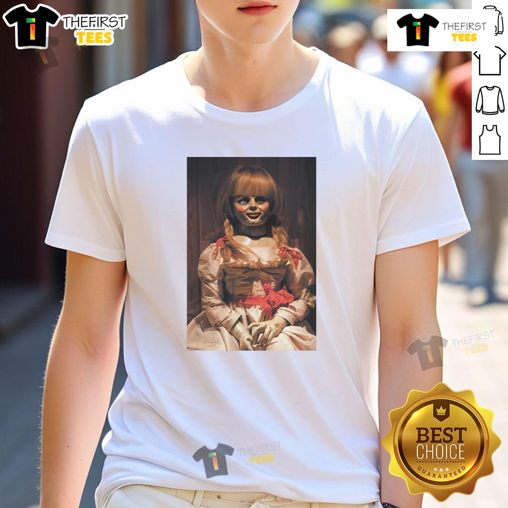 Top The Conjuring Last Rites Annabelle T Shirt Alt Text: Top The Conjuring Last Rites Annabelle T-Shirt featuring eerie graphic design, perfect for horror movie fans.