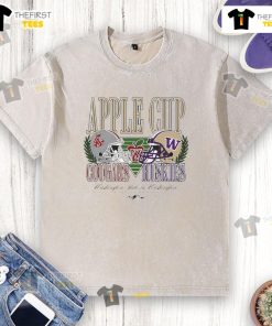 Alt Text: Top Washington State Cougars and Washington Huskies football Apple Cup rivalry helmet on a washed T-shirt.
