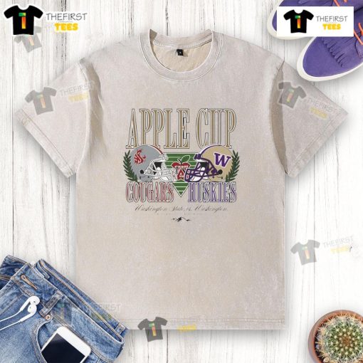 Alt Text: Top Washington State Cougars and Washington Huskies football Apple Cup rivalry helmet on a washed T-shirt.