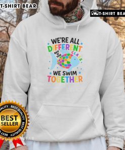 Alt Text: Colorful fish hoodie design featuring the phrase Top, We're All Different, But In This Class, We Swim Together.