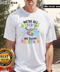 Alt Text: Colorful fish swim together on a vibrant t-shirt with the phrase We're All Different But In This Class We Swim Together.