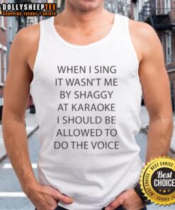 Person wearing a tank top singing 'It Wasn't Me' by Shaggy at karaoke, showcasing their vocal talent and fun vibes.