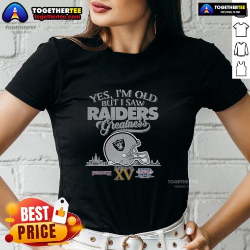 Alt Text: Ladies tee featuring 'Top-Yes-Im-Old-But-I-Oakland-Raiders-Greatness' with Super Bowl helmet and skyline design.
