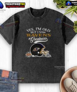 Vintage Baltimore Ravens Super Bowl helmet graphic on a washed t-shirt with skyline design, celebrating team greatness.