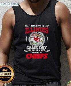 Cheerful fan wearing a Kansas City Chiefs tank top, showcasing team spirit while living in Illinois on game day.