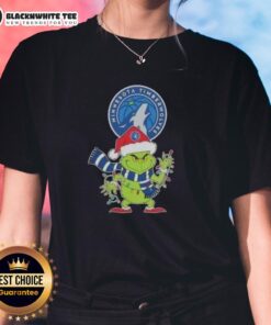 Alt Text: Ladies tee featuring the Minnesota Timberwolves Grinch Santa hat design for a festive 2025 Christmas celebration.