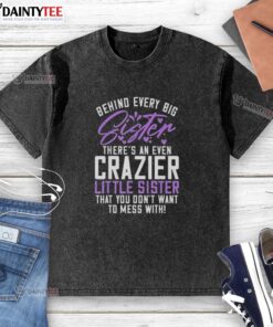 Awesome washed t-shirt featuring 'Behind Every Big Sister There's An Even Crazier Little Sister' design for siblings.