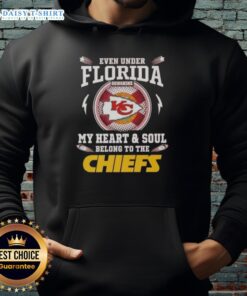 Person wearing a Kansas City Chiefs hoodie enjoying the Florida sunshine, showcasing team pride and style.