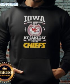 Person wearing a Kansas City Chiefs hoodie, enjoying the sunny Iowa weather, showcasing team pride and style.
