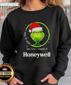 Funny Grinch Christmas sweatshirt with 'I Used to Smile and Then I Worked at Honeywell' design, perfect for holiday cheer.