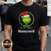 Funny Grinch Christmas t-shirt featuring 'I Used To Smile And Then I Worked At Honeywell' design for holiday humor.