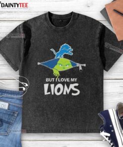 Awesome Grinch design on a washed t-shirt showcasing love for Detroit Lions football, perfect for fans.
