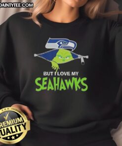 Awesome Grinch sweatshirt featuring Seattle Seahawks logo, perfect for football fans celebrating the holiday season.
