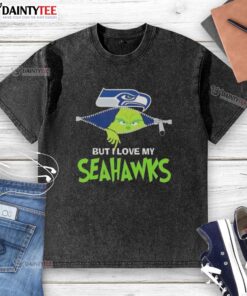 Awesome Grinch graphic on a washed Seattle Seahawks football t-shirt, perfect for fans showing team spirit.