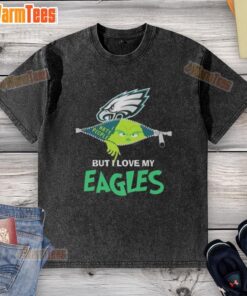 Alt Text: Awesome Grinch Christmas design on a washed t-shirt featuring Philadelphia Eagles logo for holiday football fans.