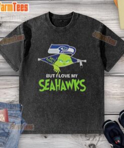 Alt Text: Awesome Grinch Christmas washed t-shirt featuring Seattle Seahawks logo, perfect for holiday NFL fans.