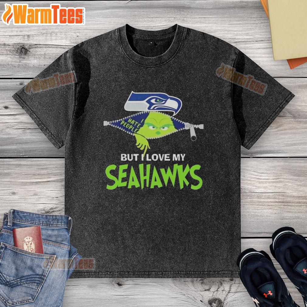 awesome-grinch-christmas-but-i-love-my-seattle-seahawks-washed-t-shirt Alt Text: Awesome Grinch Christmas washed t-shirt featuring Seattle Seahawks logo, perfect for holiday NFL fans.