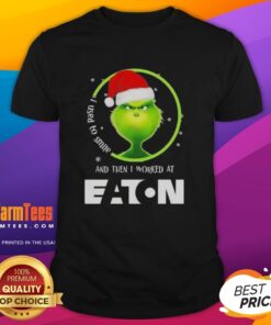 Alt Text: Awesome Grinch Christmas t-shirt featuring 'I Used To Smile And Then I Worked At Eaton Corporation' design.
