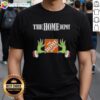 Awesome Grinch hands holding a Christmas ornament on a Home Depot T-Shirt, perfect for holiday festivities and gifts.